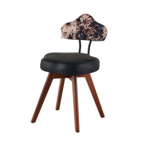 Accent chair with shaped patterned back, plain black seat, open back supports and brown wood-tone legs, front three-quarter view